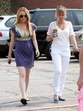 Lindsay Lohan in different outfits shows cleavage and pokies on the set of Labor Pains